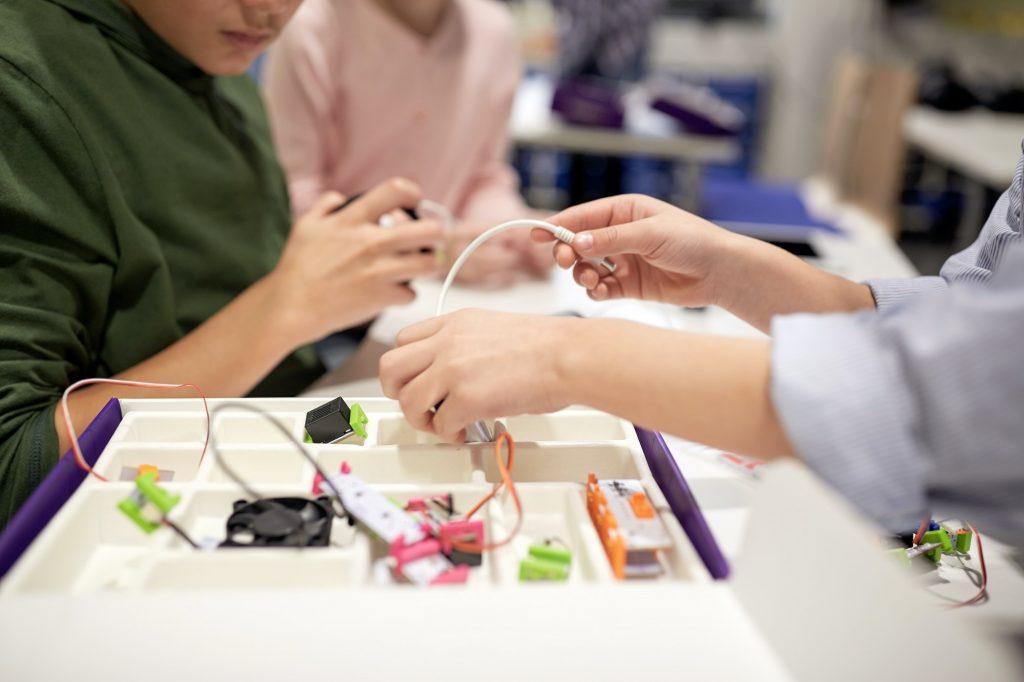 children with building kit at robotics school