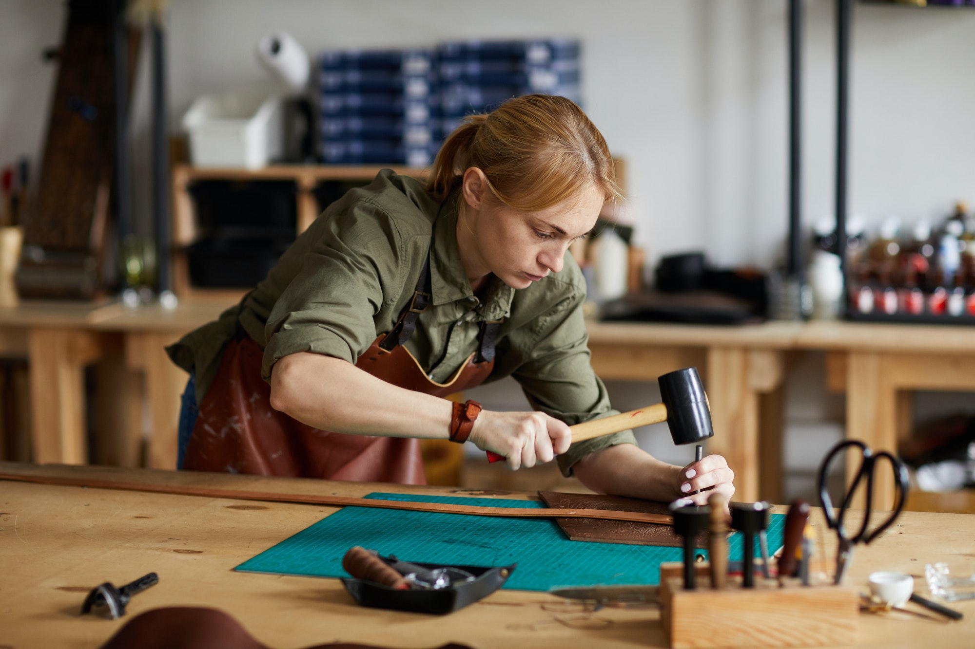 Female Craftsman Working in Shop