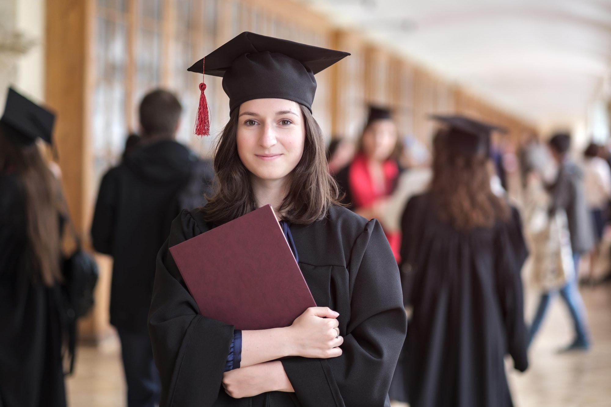 Happy caucasian woman on her graduation day at University.