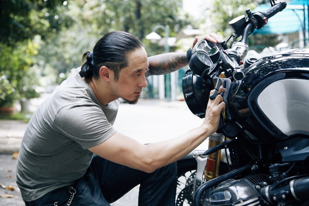 Man Wiping Bike With Soft Cloth