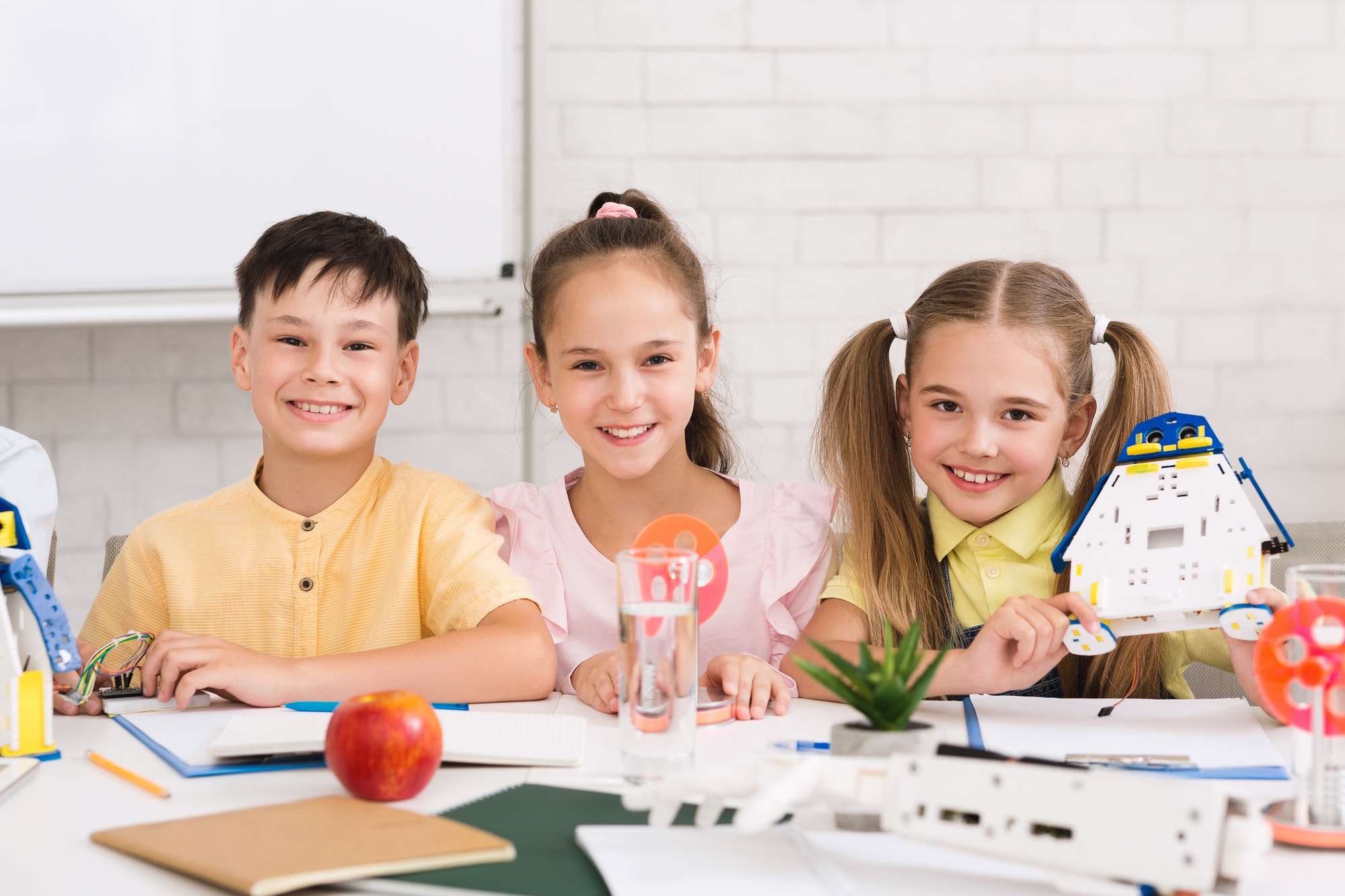 Pupils building robots in after school stem class