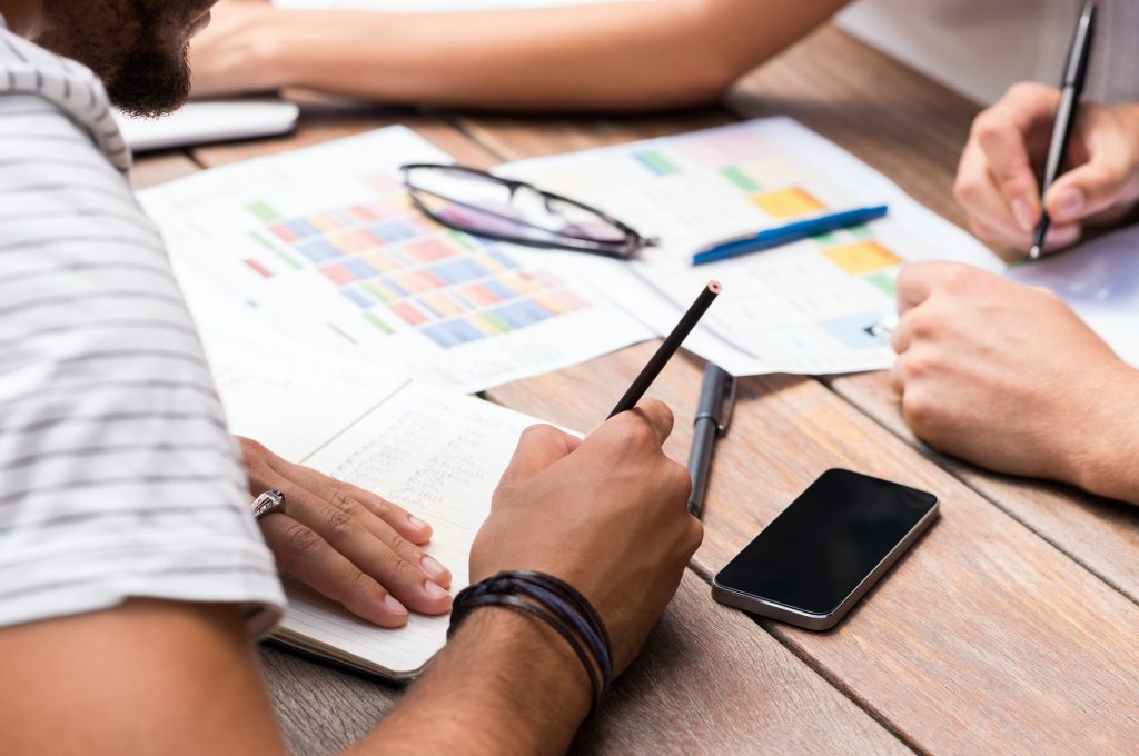 Students writing notes