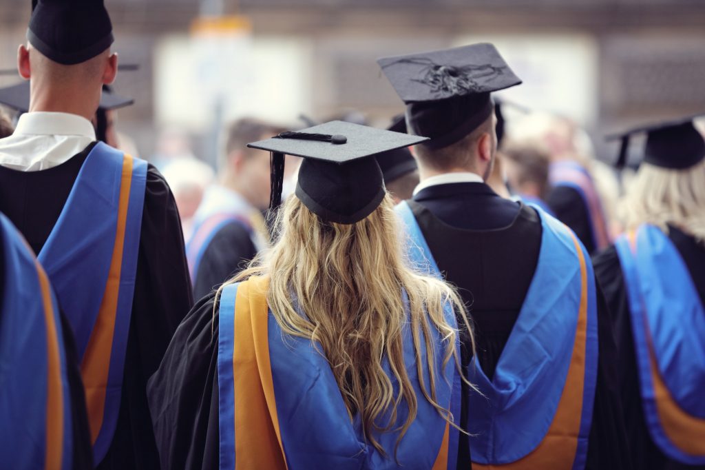 University graduates at graduation ceremony