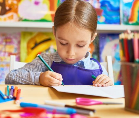 little-girl-drawing-in-pre-school-HQEMYWC.jpg